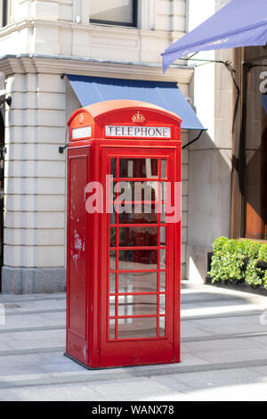 typical phone box in London street Stock Photo