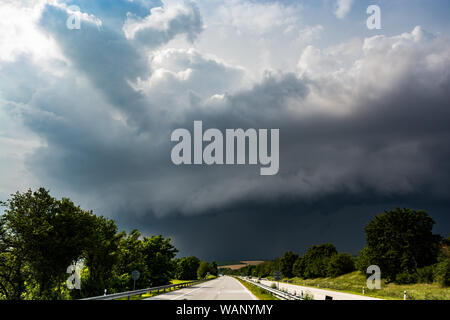 Shelf cloud with storm above highway in Czech Republic Stock Photo