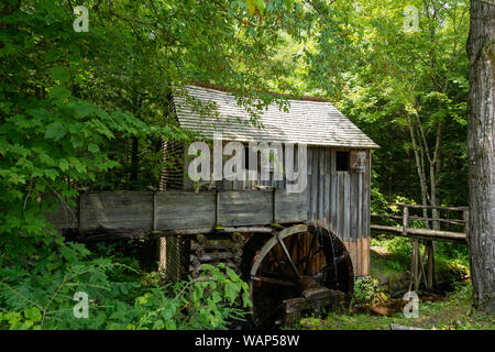 Water wheel and old mill in the woods.  Cades Cove, Smoky Mountains National Park, Tennessee Stock Photo