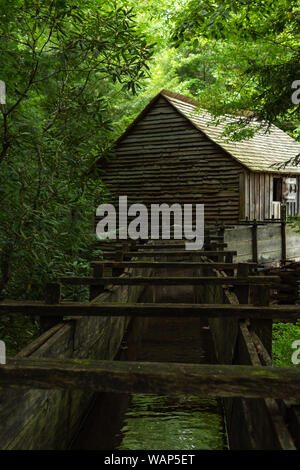 Water wheel and old mill in the woods.  Cades Cove, Smoky Mountains National Park, Tennessee Stock Photo