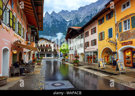 Mittenwald, Germany - 11 July 2019: Colorful painted houses in the Old town of Mittenwald, a popular tourist destination in Alps mountains, Bavaria Stock Photo