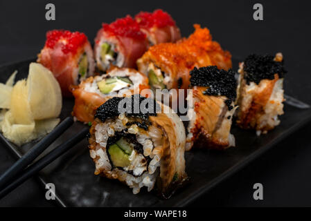 Philadelphia roll sushi with salmon, prawn, avocado, cream cheese. Sushi menu. Japanese food. Stock Photo