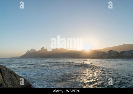 Sunset over the Mountains of Rio de Janeiro from Arpoador, Ipanema Stock Photo