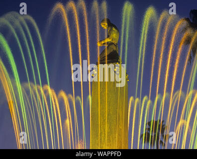 Historic art deco fountain with colorfully illuminated water jets at dusk  in Beverly Hills, California, USA Stock Photo