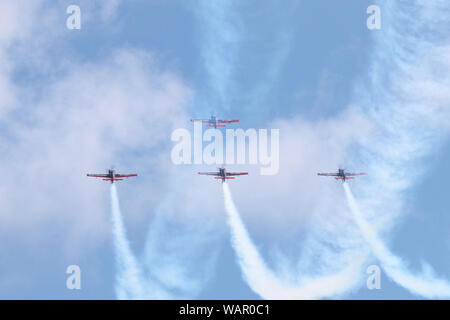 The Blades Aerobatic Display Team climb up into their previous smoke trails as they set up for another stunt. Stock Photo