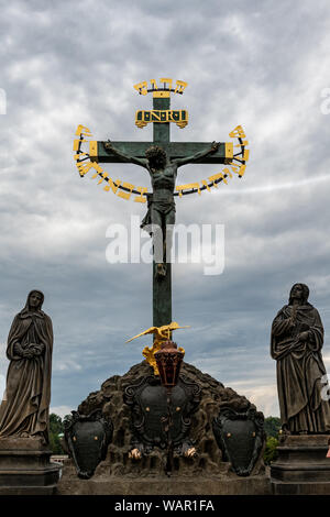The Crucifix and Calvary on Charles Bridge in Prague, Czech Republic Stock Photo