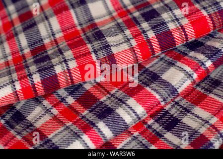 Red, blue and white tartan pattern cloth. Texture detail close up. Stock Photo