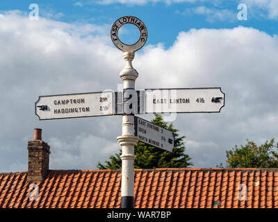 A charming sign post in the village of Athelstaneford, East Lothian, Scotland, UK.