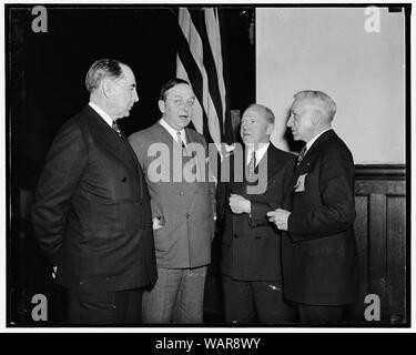 Discuss plans for mobilizing 2,000,000 men. Washington, D.C., March 28. Plans for the most intensive recruiting campaign in American history, to be followed by enactment of a selective service law which would provide a military force of 2,000,000 men within four months, were expected to be perfected at a selective service conference, which opened today at the Army Medical Center today. In the spotlight at the meeting were, left to right: Maj. Gen. Albert H. Blanding, Chief, US. National Guard Bureau; Rear Admiral Aldolphus Andrews, Chief Bureau of Navigation, US. Navy; Maj. General Thomas Holc Stock Photo