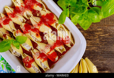 Stuffed pasta jumbo shells with spinach and ricotta cheese. Stock Photo