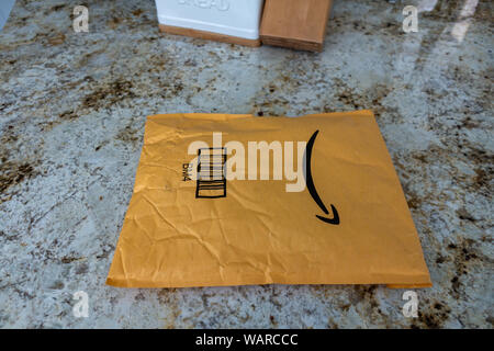Orlando,FL/USA-8/20/19:  An Amazon package ordered online and delivered to a home sitting on a kitchen counter. Stock Photo