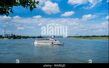 excursion boat  MS Stadt Düsseldorf cruising the river Rhine west of the Rheinknie bridge, Düsseldorf, North Rhine-Westphalia, Germany Stock Photo