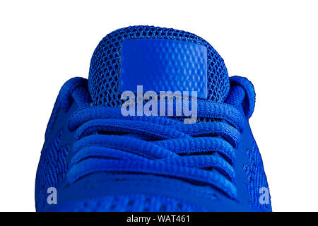 Fragment of a blue sneaker with drawstring macro.Sneaker texture Stock Photo