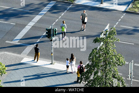 Berlin, Germany. 19th Aug, 2019. Pedestrians at a pedestrian traffic light in Alexanderstraße at Alexanderplatz. While some passers-by wait for the green of the traffic lights, others already cross the street. Credit: Jens Kalaene/dpa-Zentralbild/ZB/dpa/Alamy Live News Stock Photo