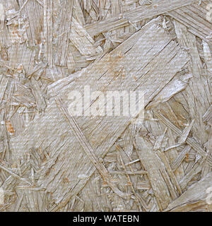 OSB boards are made of sawdust polished on a wooden background. Recycled compressed wood chipboard. Pressed wooden panel Stock Photo