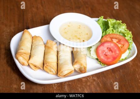 Fried chinese spring rolls on white dish Stock Photo