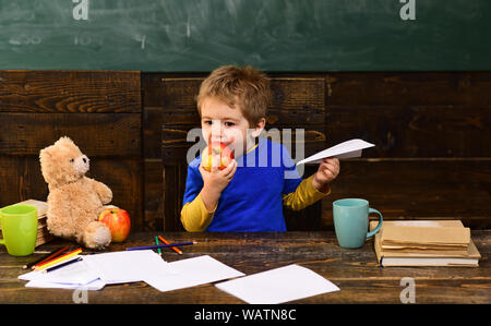 Lecturer discussing architectural issues with students during workshop. Good teachers help students ask great questions. Hipster is solving math exam. Stock Photo