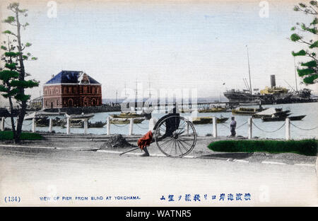 [ 1890s Japan - Japanese Harbor ] —   View of the pier from the Bund in Yokohama, Kanagawa Prefecture. A rickshaw puller rests in front, while a steamer can be seen in the background.  20th century vintage postcard (of older photo). Stock Photo