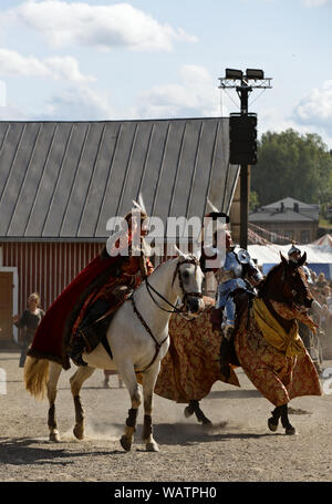 Hameenlinna Finland 08/17/2019 Medieval festival with craftsman, knights and entertainers. Knights greeting audience. Stock Photo