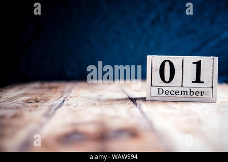 December 1st, 1 December, First of December - White block calendar on vintage table present date on dark background Stock Photo