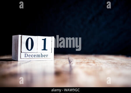 December 1st, 1 December, First of December - White block calendar on vintage table present date on dark background Stock Photo