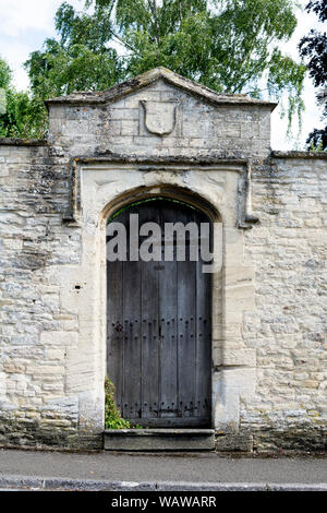 A gateway in a stone wall, Northleach, Gloucestershire, England, UK Stock Photo