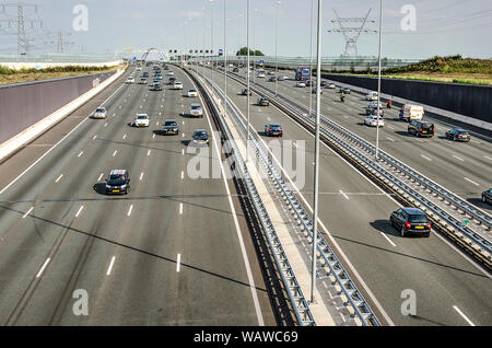 Muiden, The Netherlands, August 21, 2019: aerial view of the A1 motorway between Amsterdam and Amersfoort, with 2 x 5 lanes and a two lane rush hour s Stock Photo