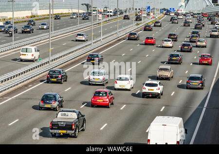 Muiden, The Netherlands, August 21, 2019: view of the A1 motorway just outside of Amstermdam during evening rush hour with a total of twelve lanes of Stock Photo