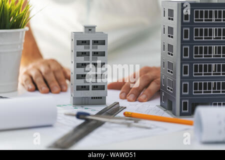 civil engineering housing development - house scale models and blueprints on the desk in office Stock Photo
