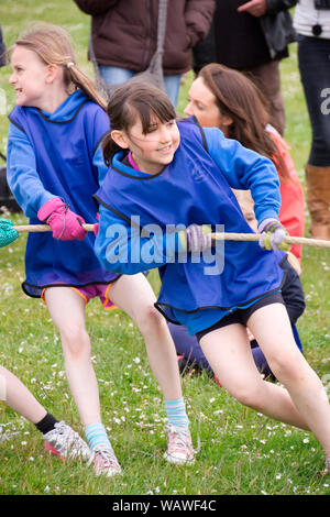 Girls tug of war at school sports day Stock Photo