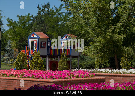 beautiful park and multi-colored children play park Stock Photo