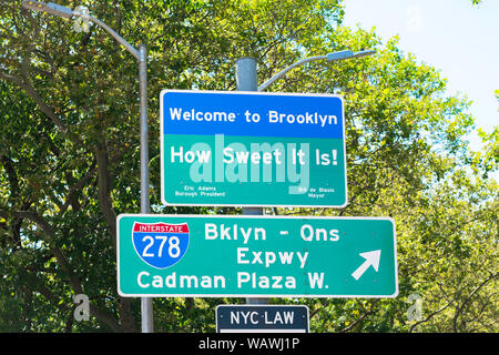 Brooklyn New York, view of a Welcome To Brooklyn sign at the eastern end of the Brooklyn Bridge, New York City, USA Stock Photo