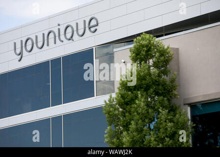 A logo sign outside of the headquarters of Younique in Lehi, Utah on July 27, 2019. Stock Photo