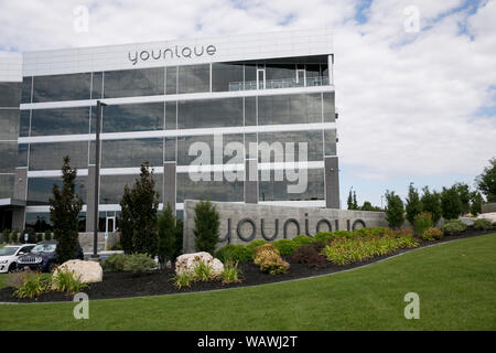 A logo sign outside of the headquarters of Younique in Lehi, Utah on July 27, 2019. Stock Photo