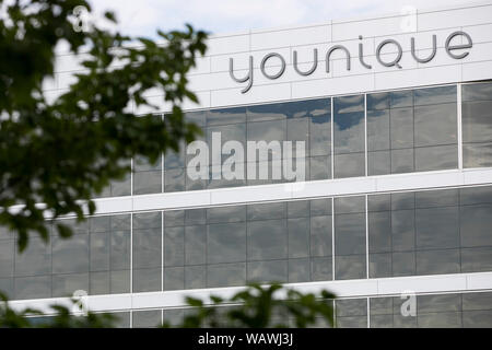 A logo sign outside of the headquarters of Younique in Lehi, Utah on July 27, 2019. Stock Photo