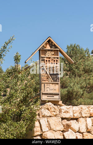 Insect house, artificial habitat to attract insect, Spain. Stock Photo