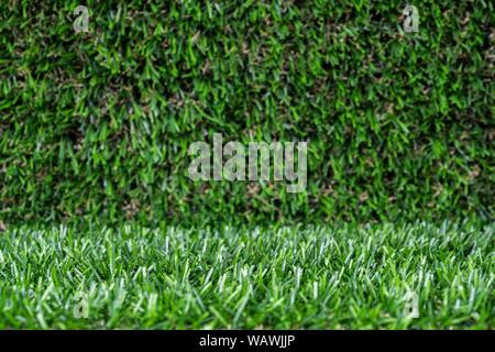 artificial grass backdrop with selective focus. Stock Photo