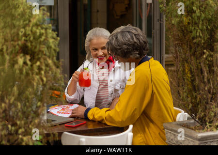 Cheerful adult couple preparing for their walk. Stock Photo