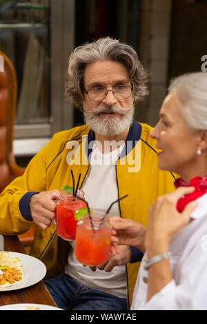 Man listening to a speech of his wife. Stock Photo