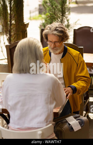 Husband and wife having lunch after the arrival. Stock Photo