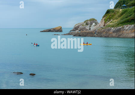 Kayak in the sea, in the Combe Martin bay. Combe Martin is a village, civil parish and former manor on the North Devon coast Stock Photo