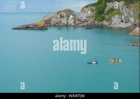 Kayak in the sea, in the Combe Martin bay. Combe Martin is a village, civil parish and former manor on the North Devon coast Stock Photo