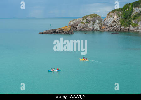 Kayak in the sea, in the Combe Martin bay. Combe Martin is a village, civil parish and former manor on the North Devon coast Stock Photo