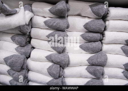 Stack of folded white socks with gray ankles closeup Stock Photo