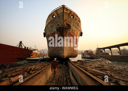Dock workers in a shipyard in Dhaka, Bangladesh. Shipbuilding in Bangladesh has become a major industry in recent years. Stock Photo