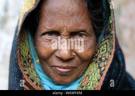 Elderly Muslim market woman in Barisal, Bangladesh Stock Photo