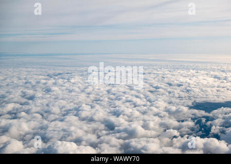 General view of low lying cloud viewed from a plane window over Europe. Stock Photo