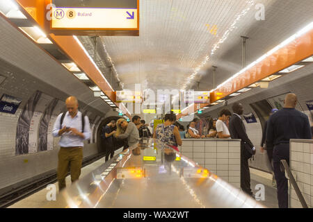 Paris metro station - Parisians waiting for metro at La Motte Picquet Grennele station. France, Europe. Stock Photo
