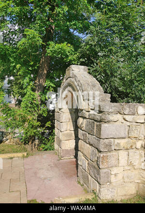 Stone gate in the wall of royal court of Piatra Neamt, Romania Stock Photo