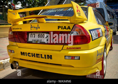 Mitsubishi Lancer yellow car. Race prepared modified sports saloon Stock Photo